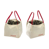 Zubehör: Big-Bags - Zwei quadratische Stofftaschen mit roten Griffen und fagus-Aufdruck, gefüllt mit dunklen Steinen, ideal für kreative Baustellen-Spielideen, hergestellt in einer geschützten Werkstätte in Deutschland.