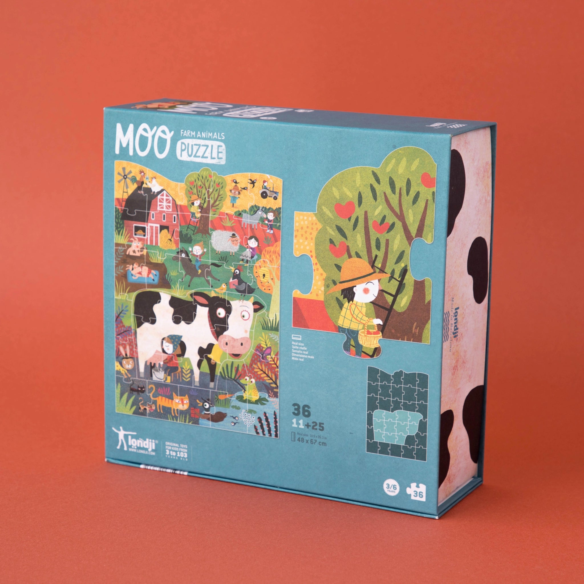 Puzzle: Moo - Eine Puzzlebox mit 36 großen Teilen, zeigt fröhliche Bauernhofszenen mit Kühen und einem cartoonartigen Jungen. Geeignet für Kinder ab 3 Jahren, aus nachhaltigen Materialien in Spanien gefertigt.