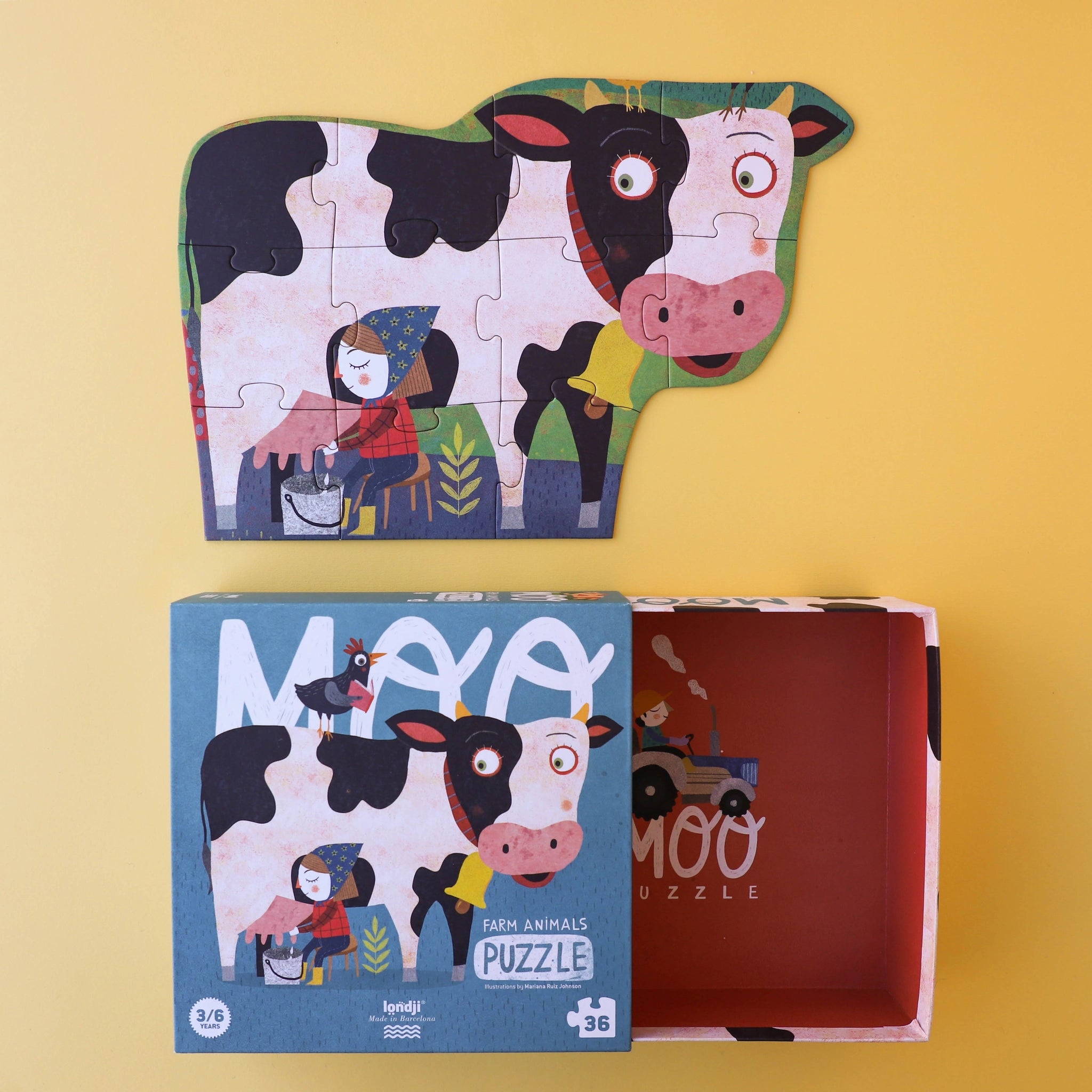 Puzzle: Moo - Eine Puzzlebox mit 36 großen, einfach greifbaren Teilen, zeigt eine Cartoon-Kuh und Huhn auf dem Bauernhof. Aus nachhaltigem FSC-Papier und recyceltem Karton, ideal für Kinder ab 3 Jahren.