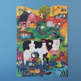 Puzzle: Moo – Ein 36-teiliges Puzzle mit Bauernhofszenen, darunter Tiere und Menschen in cartoonartigem Stil. Große, leicht zu greifende Teile, ideal für Kinder ab 3 Jahren.