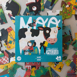 Puzzle: Moo – Ein 36-teiliges Kinderpuzzle mit cartoonhaften Bauernhofmotiven wie Kuh, Huhn und Windmühle. Große Teile, ideal für kleine Hände. Fördert kreatives Spielen, hergestellt aus nachhaltigen Materialien.