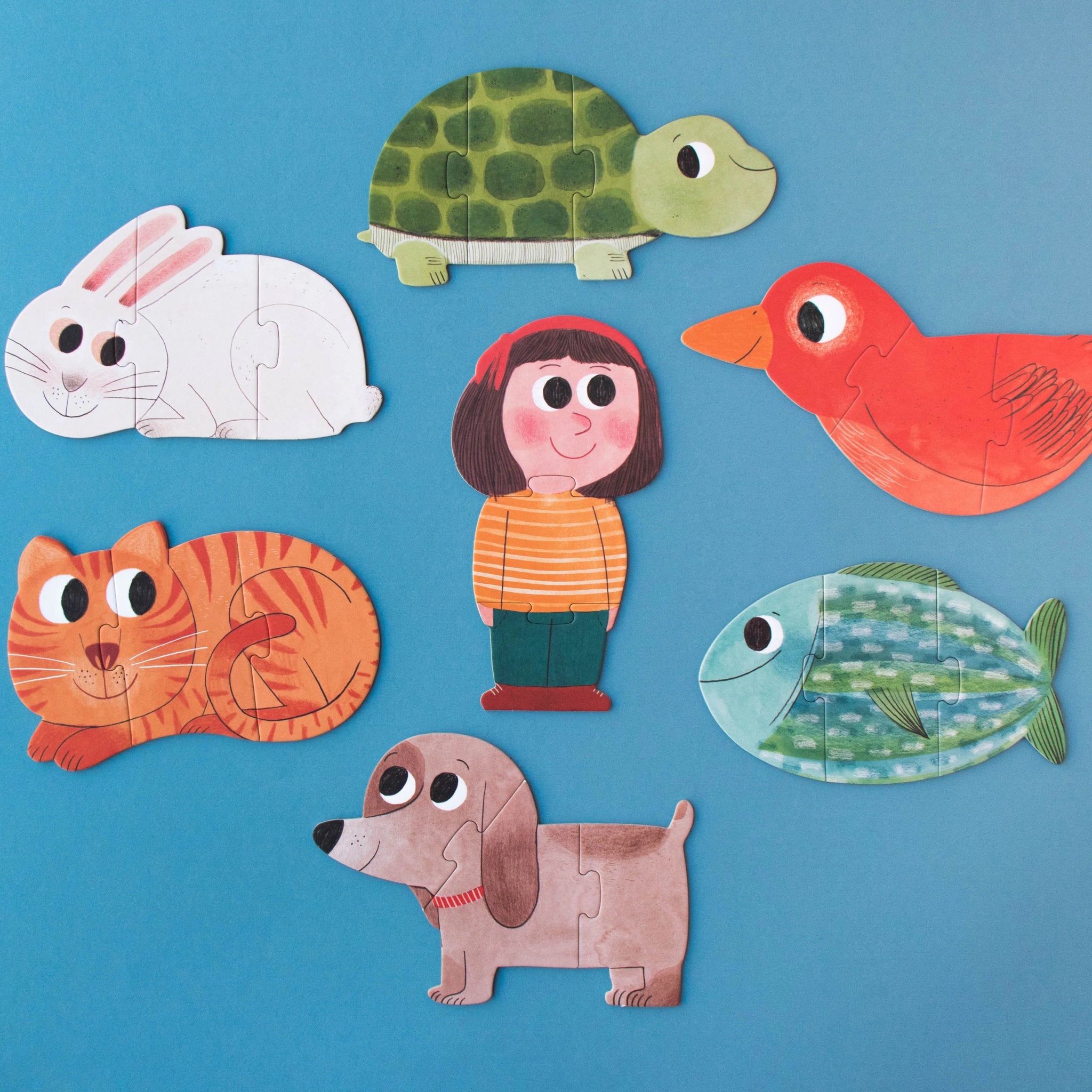 Puzzle: I love my pets, zeigt Cartoon-Tiere wie Katze, Hund, Kaninchen und Fisch als dreiteilige Puzzles aus recyceltem Material, ideal für Kinder ab 3 Jahren. Nachhaltig in Spanien hergestellt.