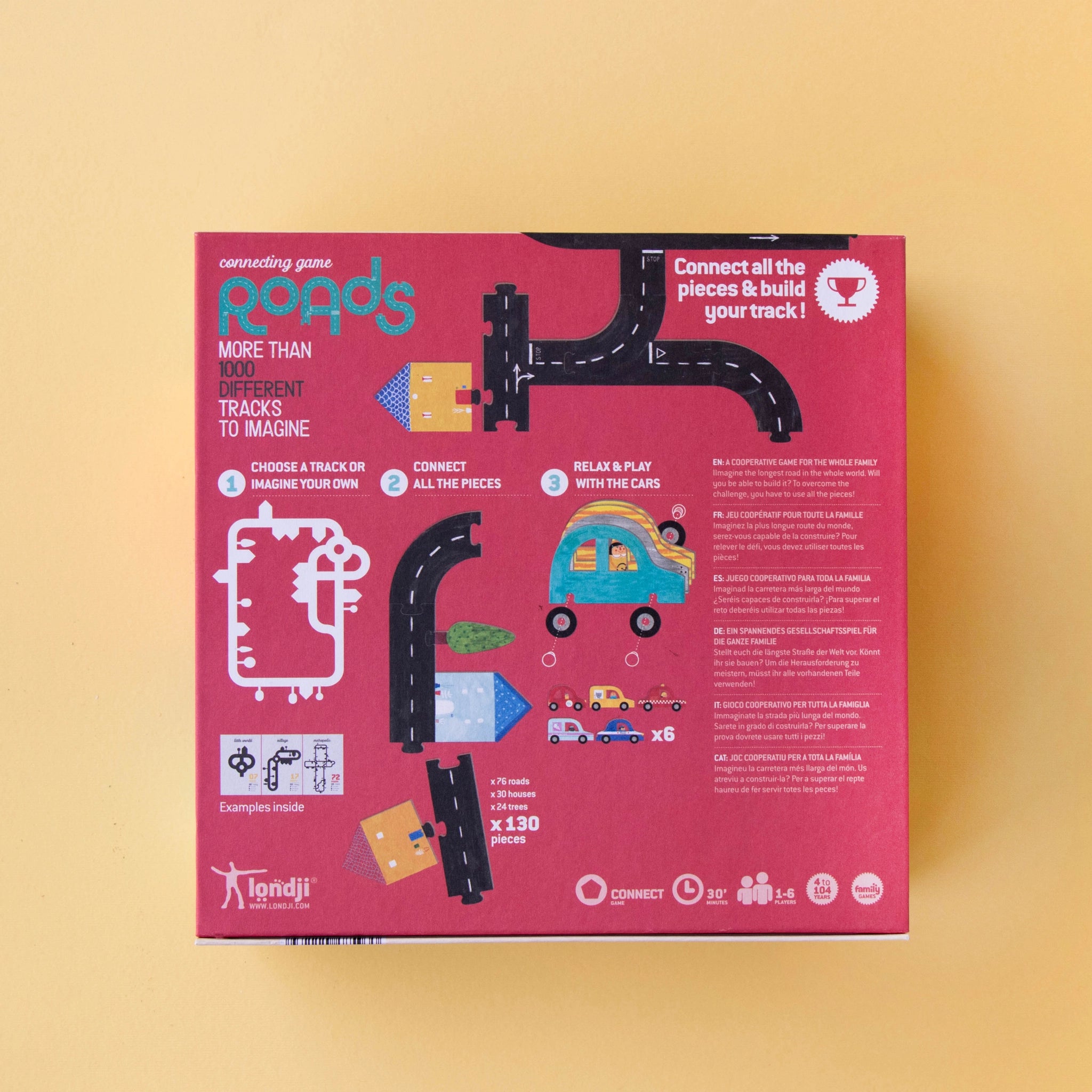 Gesellschaftsspiel: Roads in einer Box mit Straßen- und Kartenmotiv, enthält Anleitung und 6 Autos. Kreatives Spiel aus recyceltem Material, hergestellt in Spanien, eignet sich für Familien- oder Solospiel.