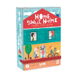 Lernspiel: Home Sweet Home, ein Kartenspiel in einer Box, zeigt Cartoon-Illustrationen von Kindern und Tieren. Es fördert strategisches Denken und Rechnen, geeignet für Kinder ab 7 Jahren.