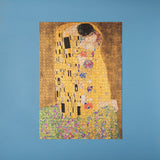 Puzzle: The Kiss, ein 1000-teiliges Puzzle, zeigt Klimts berühmtes Gemälde Der Kuss. Perfekt zum Rahmen und Aufhängen, hergestellt aus FSC-Papier und recyceltem Karton in Spanien.