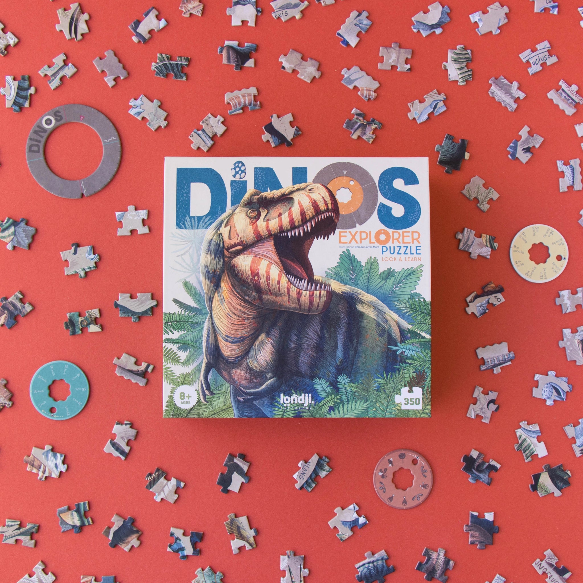 Puzzle: Dinos Explorer - Ein 350-teiliges Puzzle für Dinosaurier-Fans, zeigt ein Dinosaurier-Motiv und enthält 3 Entdecker-Scheiben. Nachhaltig hergestellt aus FSC-Papier und recyceltem Karton in Spanien.