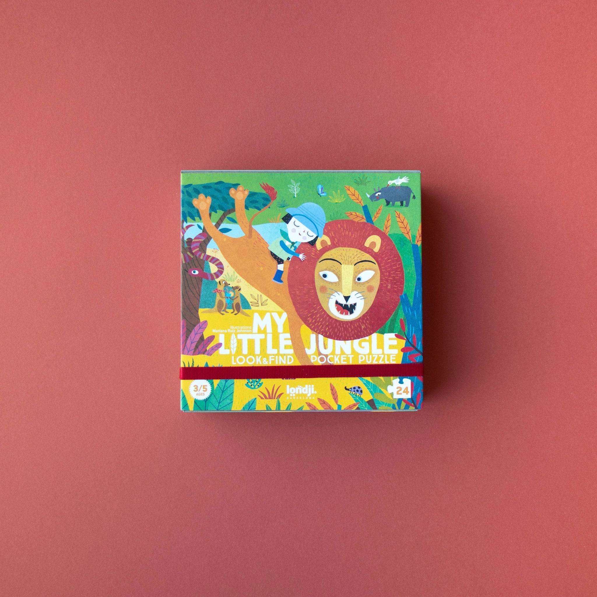 Taschenpuzzle: My little jungle, zeigt eine Cartoon-Szene mit einem Mädchen und einem Löwen. Das 24-teilige Puzzle aus recyceltem Karton ist ideal für Kinder ab 3 Jahren.